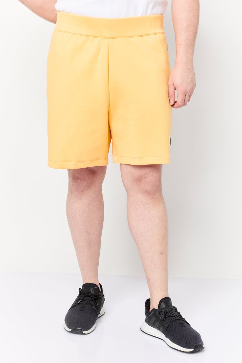 Adidas شورتات رياضية للرجال بشعار العلامة التجارية، أصفر - Image 1