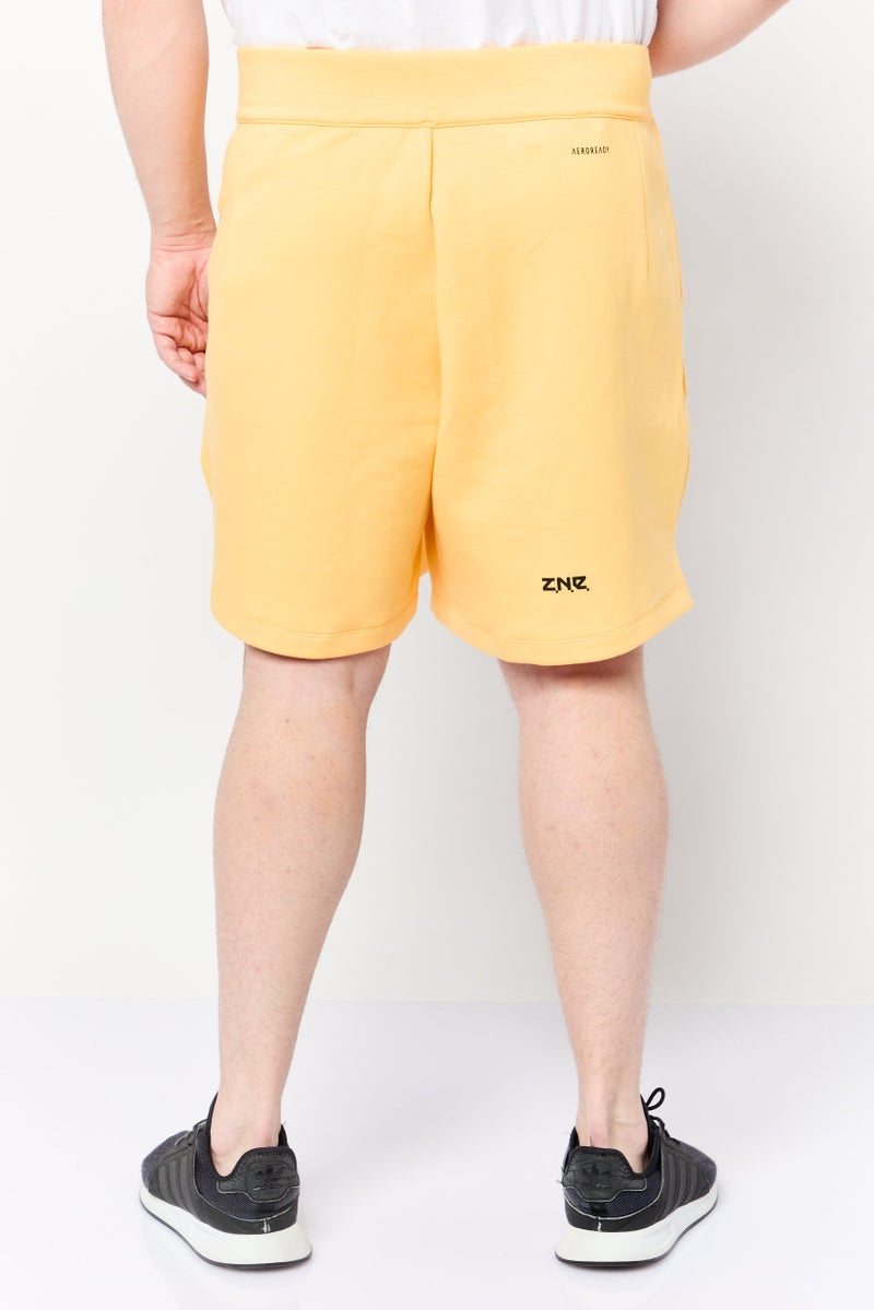 Adidas شورتات رياضية للرجال بشعار العلامة التجارية، أصفر - Image 4