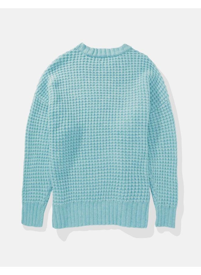 كنزة صوفية واسعة بياقة دائرية بنقشة الوافل