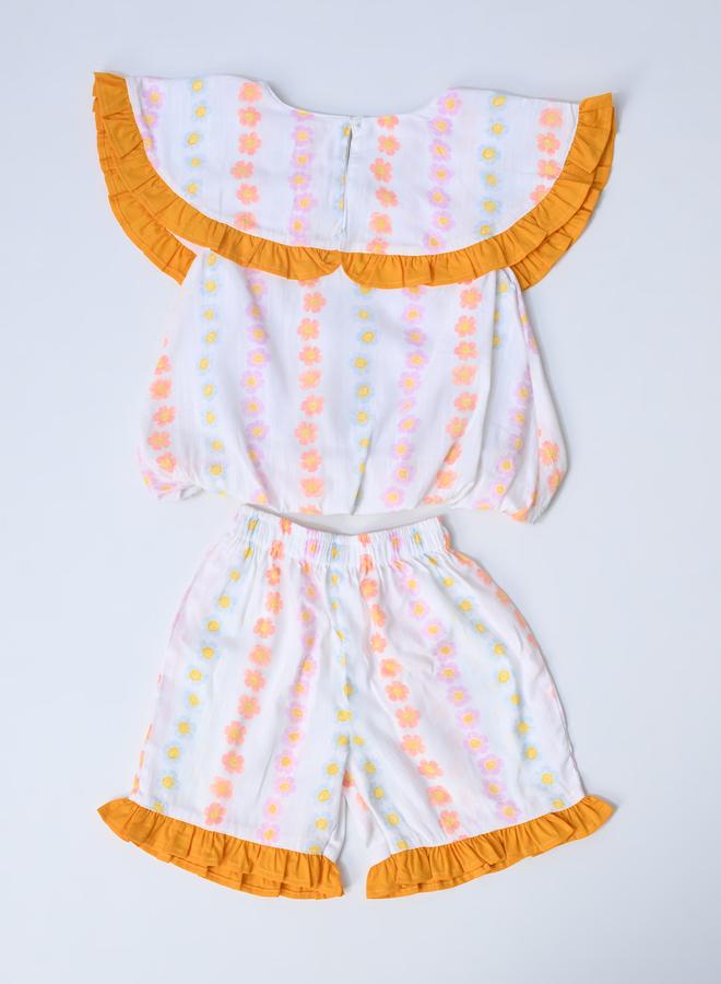 بيلا مودا طقم بلوزة بدون أكمام وشورت بطبعات وتفاصيل مكشكشة من بيلا مودا - Image 3