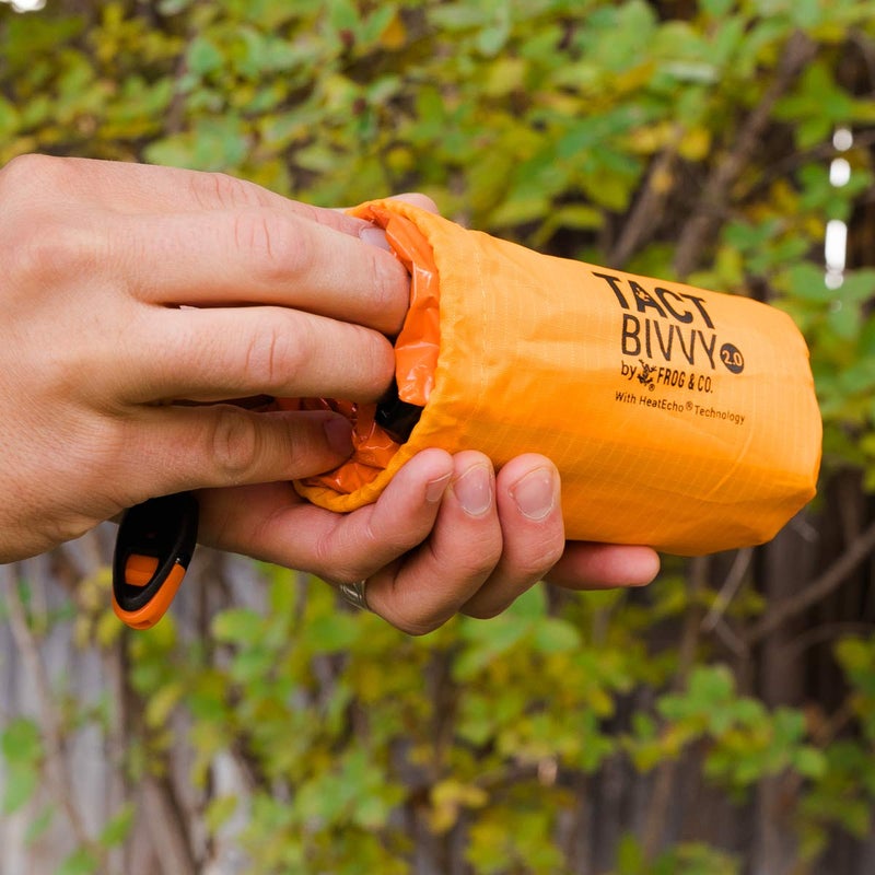 Survival Frog Tact Bivvy 2.0 Emergency Sleeping Bag w/Stuff Sack, Carabiner, Survival Whistle, ParaTinder - Compact, Lightweight, Waterproof, Reusable, Thermal Bivy Sack Cover, Shelter Kit (Orange) - Image 3