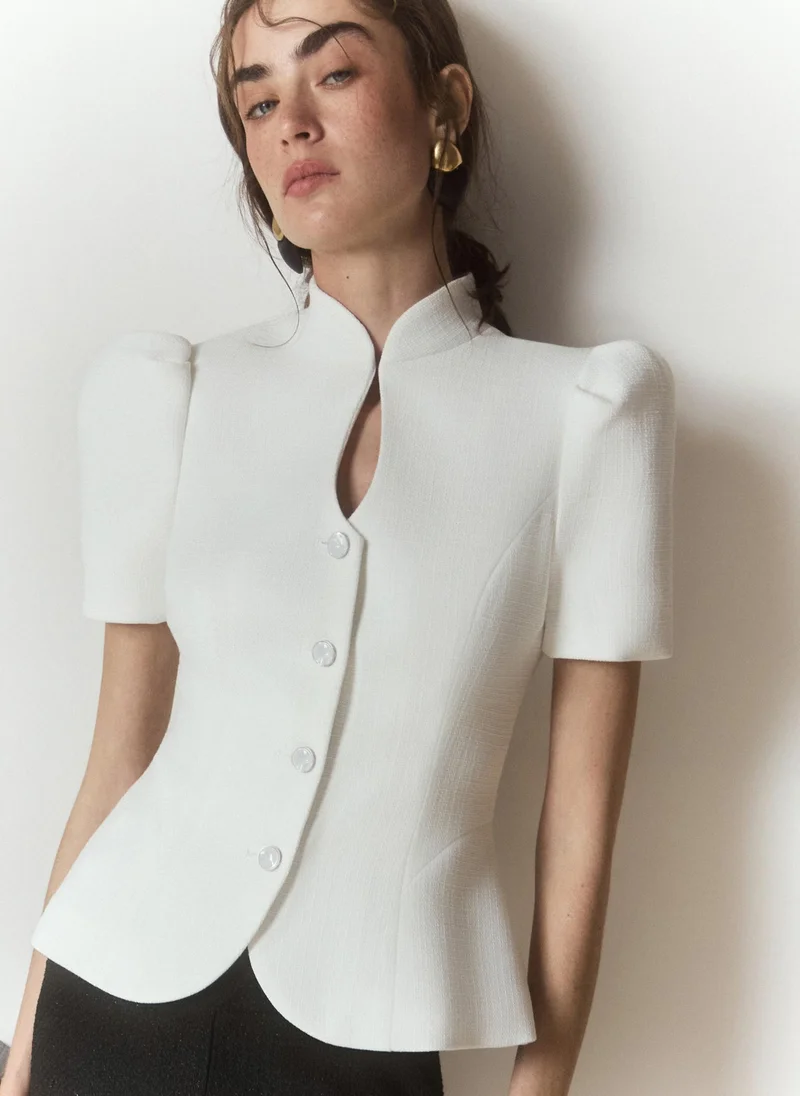 Textured fabric jacket with voluminous short sleeves