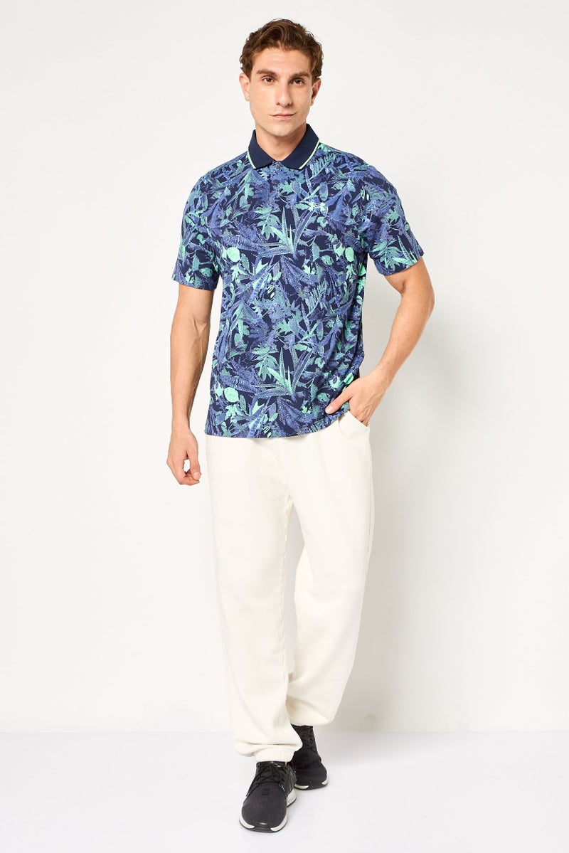 UNDER ARMOUR قميص بولو قصير الأكمام للرجال بتصميم فضفاض، متعدد الألوان - Image 3