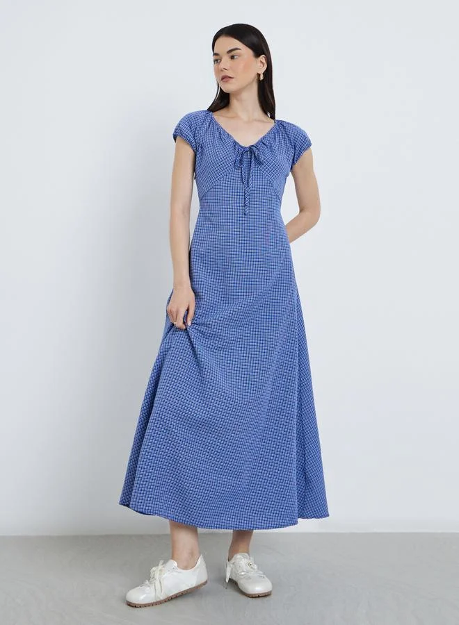 تايك تو فستان ميدي بطبعة مربعات وتفاصيل ربطة