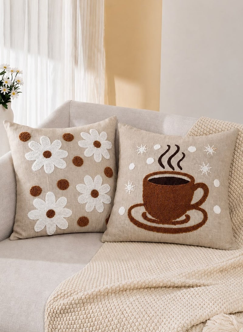 Set of two embroidered linen cushion covers featuring a distinctive coffee and floral pattern; size 45x45 cm.
