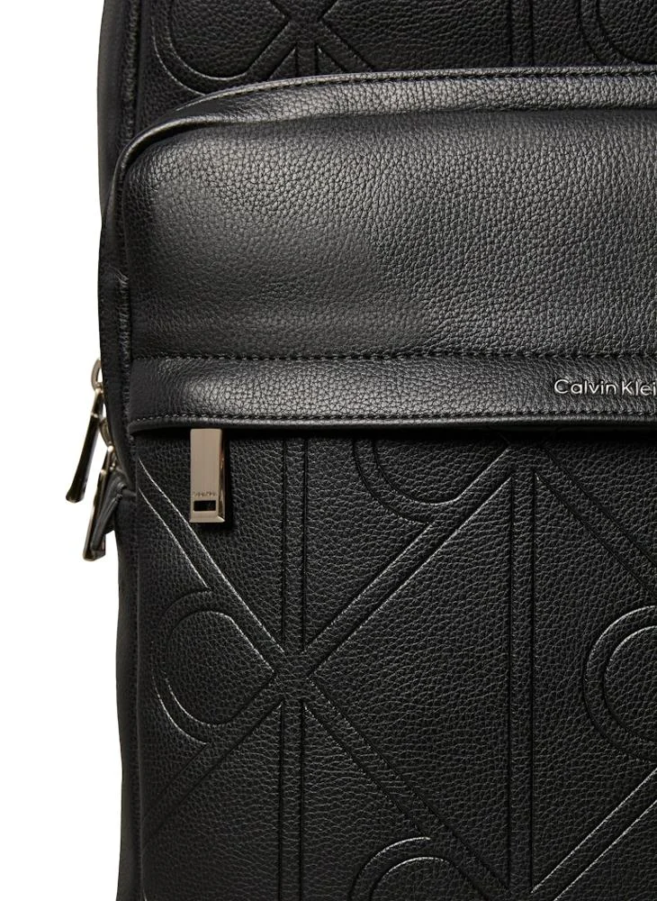 CALVIN KLEIN  Emblem AOP Embossed Round Backpack for Men | Best Price UAE