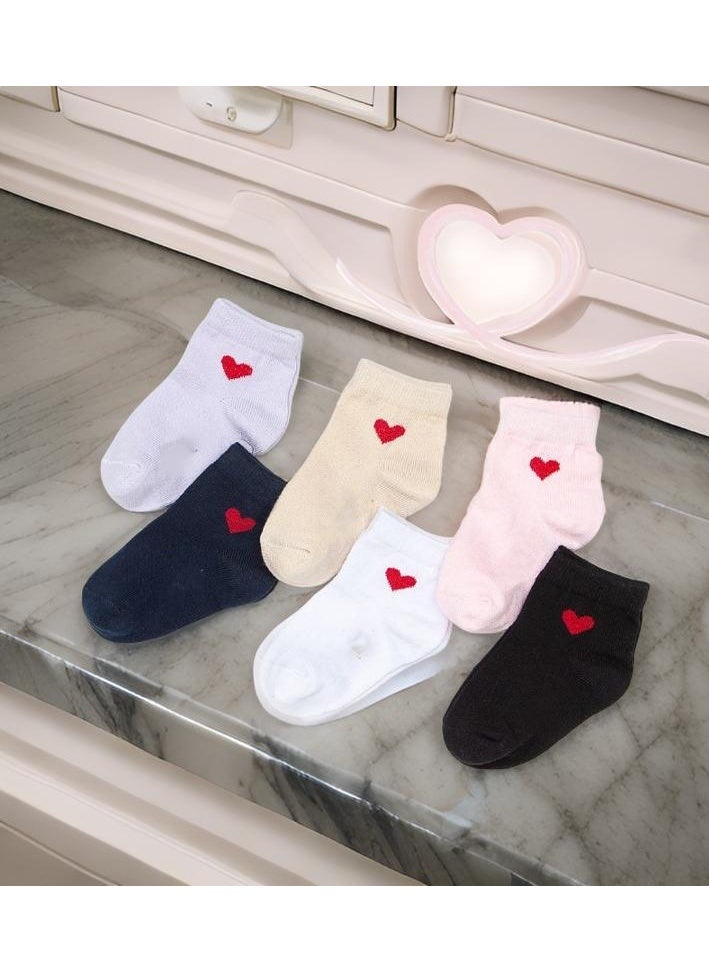 Elegant Baby Socks – 4 Stylish Pieces for Girls.