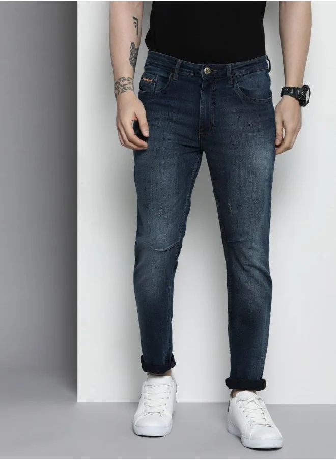 شركة المرآب الهندية Men Carrot Fit Solid Mid-Rise Stretchable Jeans