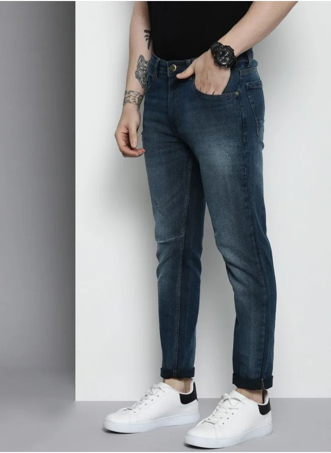شركة المرآب الهندية Men Carrot Fit Solid Mid-Rise Stretchable Jeans