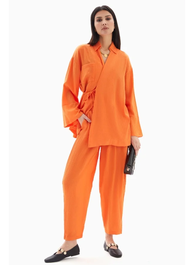 Wecre8 Orange Textured Set of Blouse with Trousers