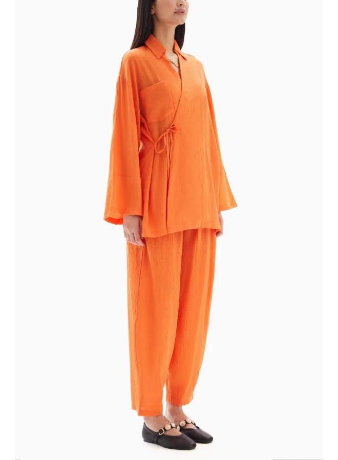 Wecre8 Orange Textured Set of Blouse with Trousers