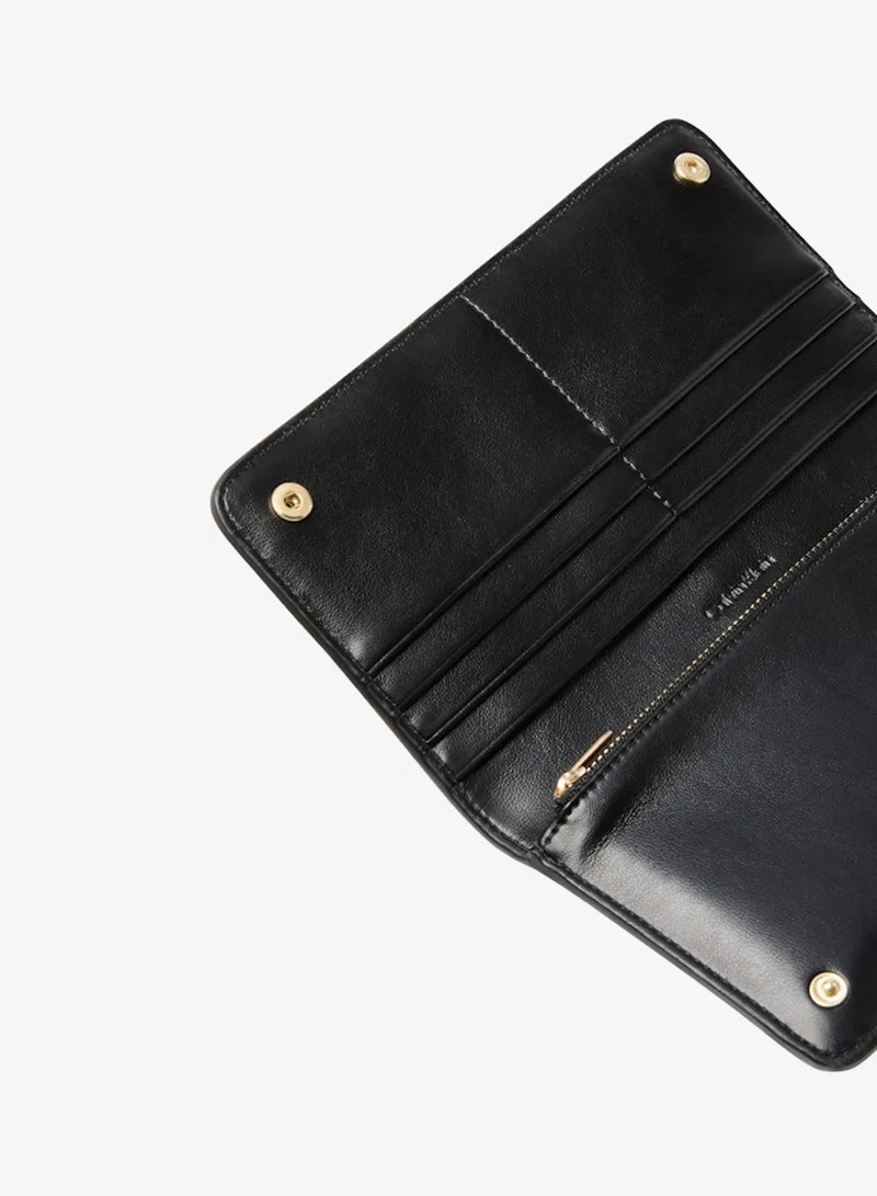 Calvin Klein Black Patchwork Logo Passport Wallet for Women | Best Price UAE