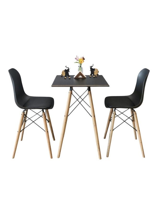 Generic Modern design table and chairs set for home and apartment, consisting of two chairs, plastic seats, wooden legs and a metal frame 