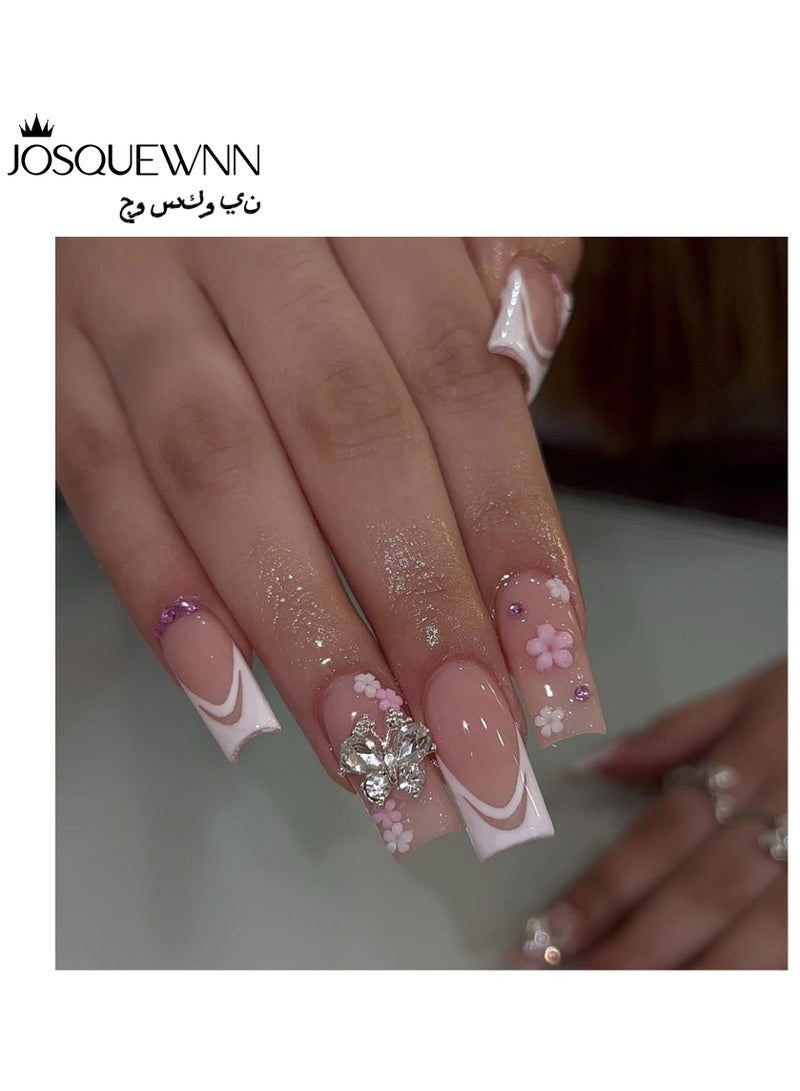 جوسكوين أظافر لاصقة 24 قطعة، نصائح أظافر متوسطة الطول على شكل بطة، مصممة بشكل أنيق مع حواف فرنسية بيضاء ومزينة بأحجار الراين على شكل bow، وتتميز بنقوش زهور رائعة. أظافر أكريليك مزيفة مع مجموعة لصق. - Image 1