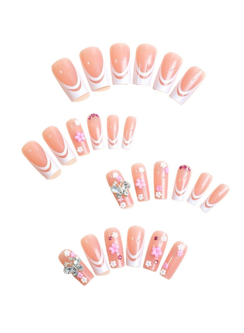 جوسكوين أظافر لاصقة 24 قطعة، نصائح أظافر متوسطة الطول على شكل بطة، مصممة بشكل أنيق مع حواف فرنسية بيضاء ومزينة بأحجار الراين على شكل bow، وتتميز بنقوش زهور رائعة. أظافر أكريليك مزيفة مع مجموعة لصق. - Image 2