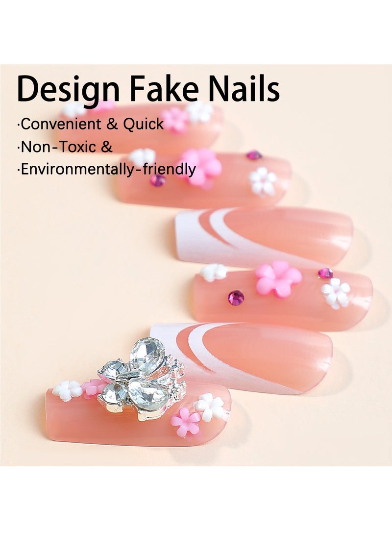 جوسكوين أظافر لاصقة 24 قطعة، نصائح أظافر متوسطة الطول على شكل بطة، مصممة بشكل أنيق مع حواف فرنسية بيضاء ومزينة بأحجار الراين على شكل bow، وتتميز بنقوش زهور رائعة. أظافر أكريليك مزيفة مع مجموعة لصق. - Image 3