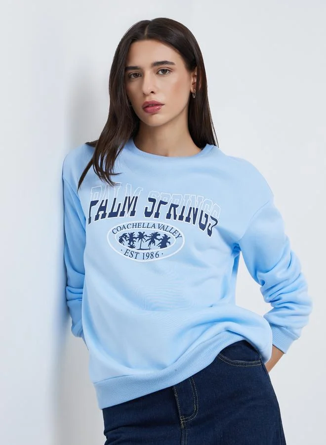 تايك تو سويت شيرت أزرق بطبعة بالم سبرينغز