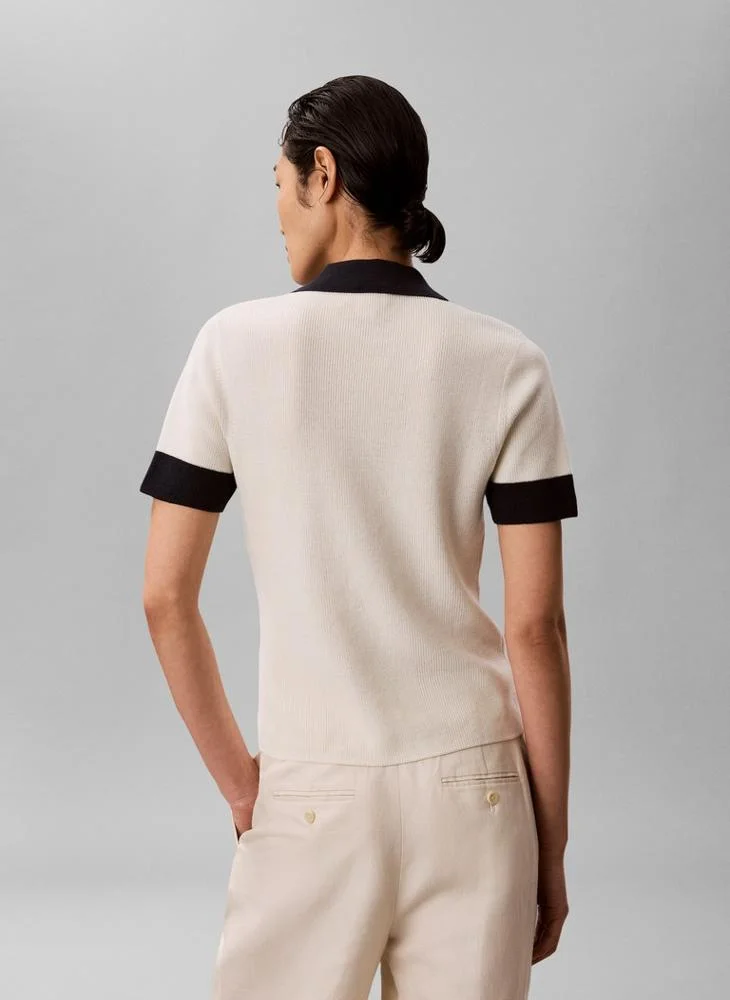 كالفن كلاين جينز قميص بولو محبوك بنقوش وفتحة أمامية