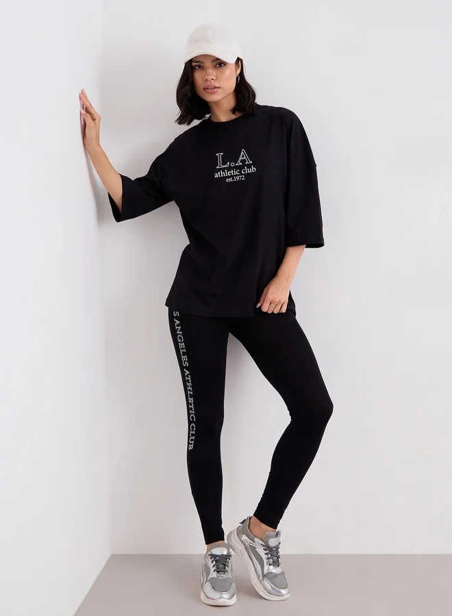 Styli Women Black Printed Oversized T-Shirt and Leggings Set