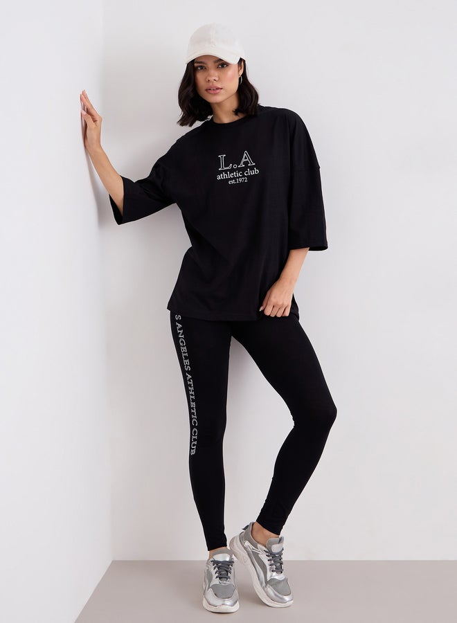 Styli Women Black Printed Oversized T-Shirt and Leggings Set - Image 1