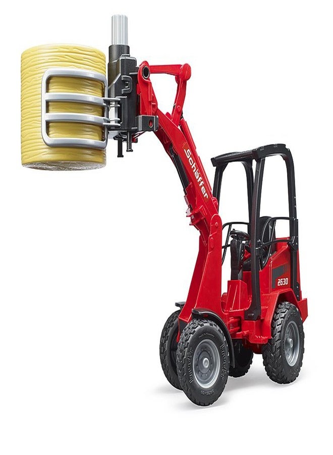 Bruder Schaeffer Compact Loader 2034 w Bale Gripper and Bale - Image 3