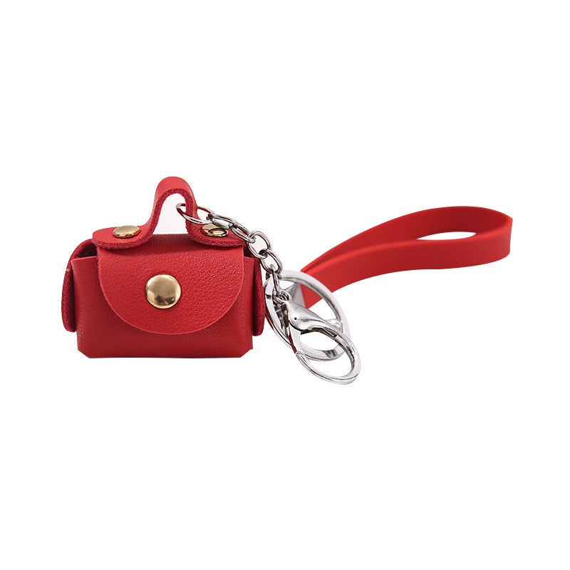 Leather mini wallet with keychain design for compact storage - Image 1