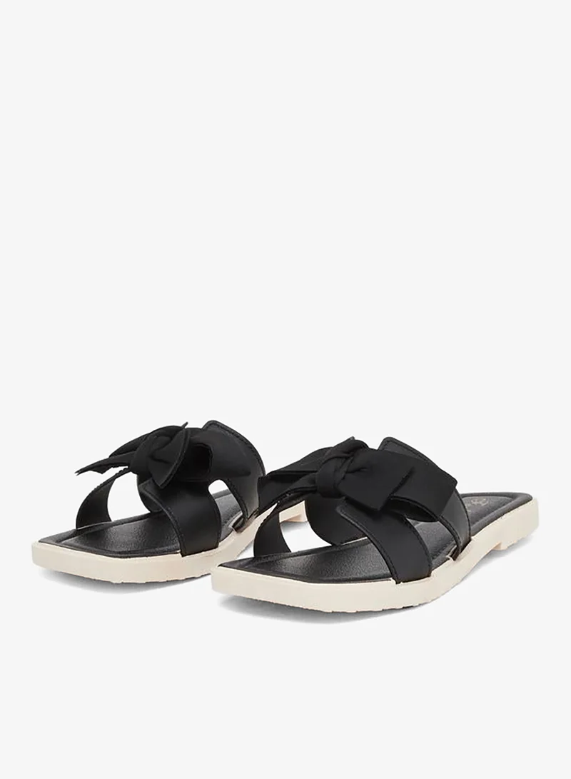 تايك تو صندل مسطح بتفاصيل فيونكة صلبة