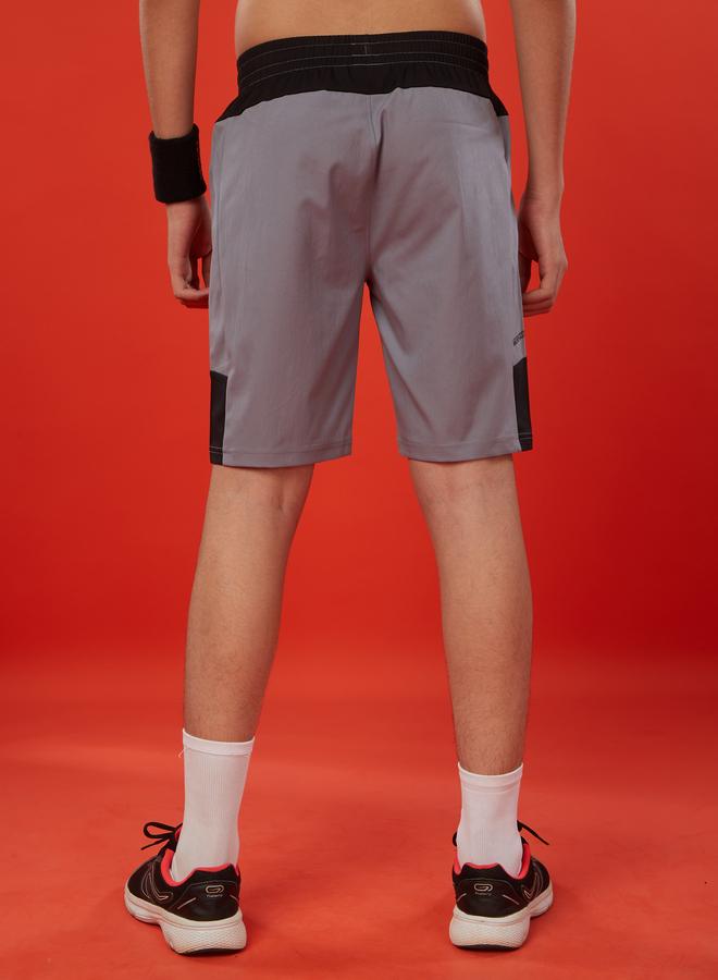 تكنوسبورت شورت رياضي شبابي بقصة ضيقة وتصميم ملون من تكنوسبورت - Image 3