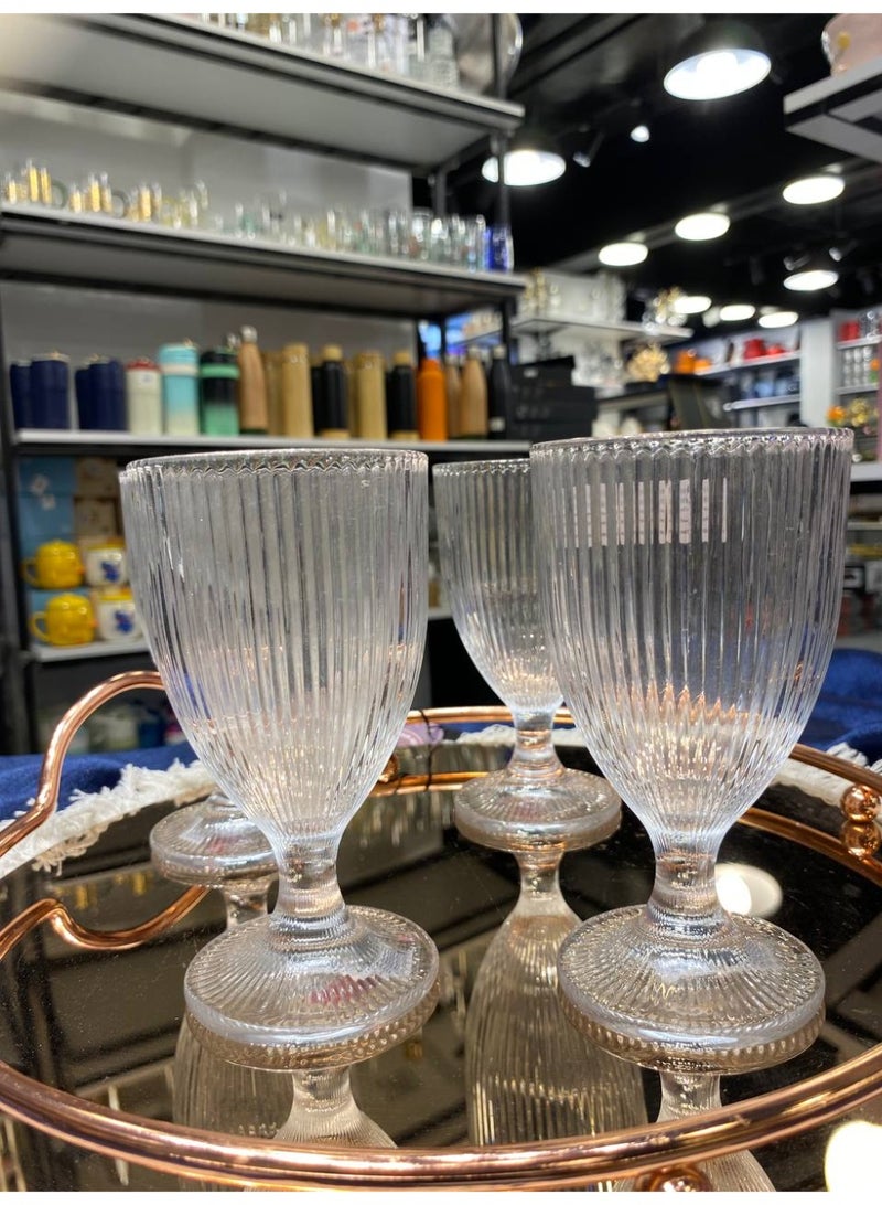 A set of exquisitely elegant, ribbed crystal glasses. Six stunning crystal glasses that add a touch of glamour to any space. Perfect for juice, water, or even ice cream. Their modern design and captivating sparkle. - Image 1