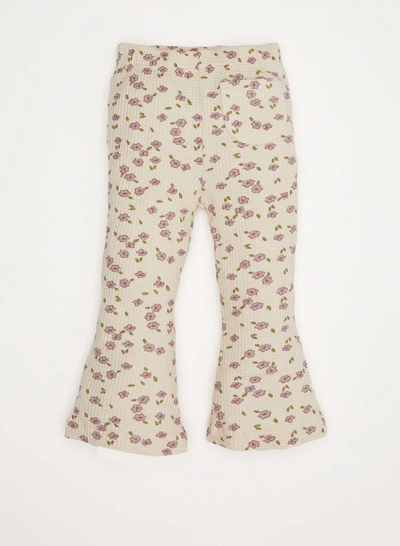 ديفاكتو بنطلون طويل بخصر مطاطي وطبعات زهور واسعة من الضلع