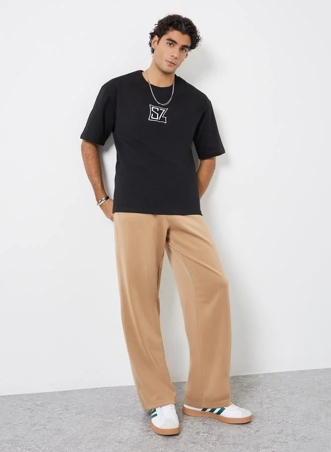 Styli Men Black Oversized Embroidered Terry T-Shirt