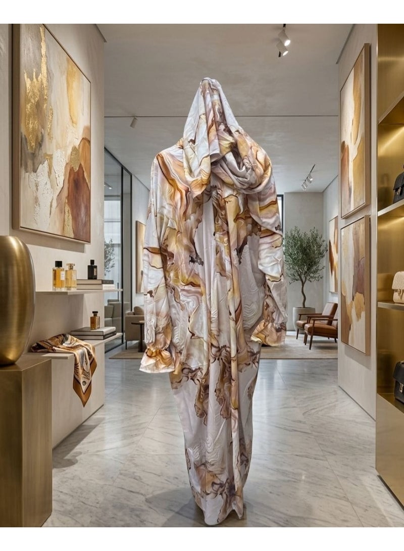 A silk abaya sheet with a modern, flowing design, featuring marble patterns in warm colors of white, beige, and brown.