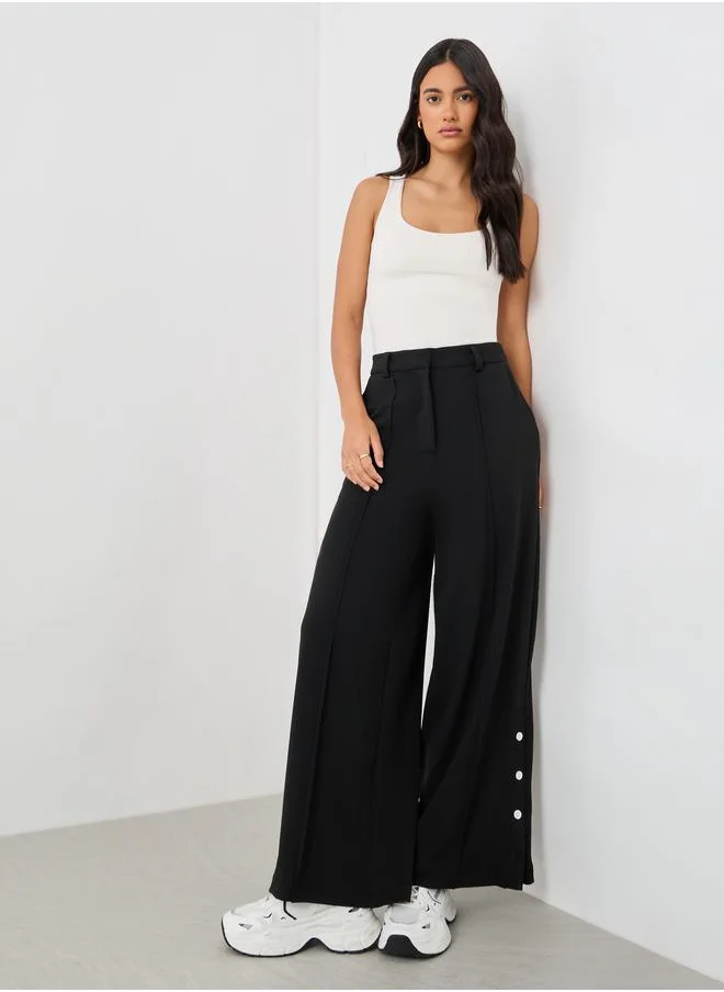 ستايلي Styli Solid Pin Tuck Detail Wide Leg Pants with Side Seam Buttons