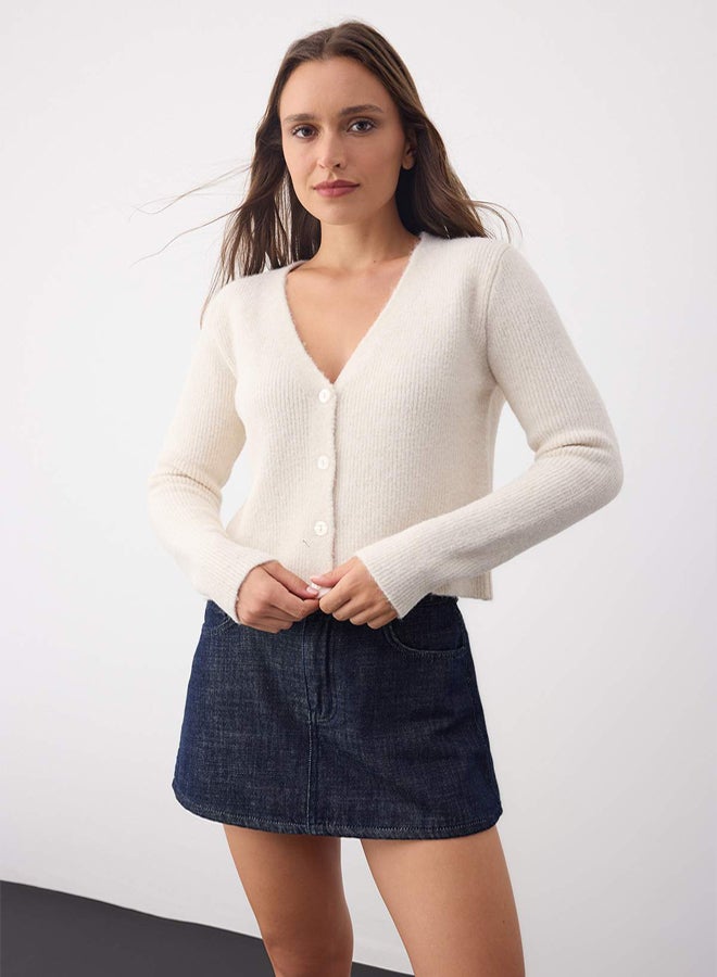 trendyol Wardrobe Essentials Ecru Crop Button Detailed Soft Textured VNeck Wool Knitwear Cardigan - Image 1