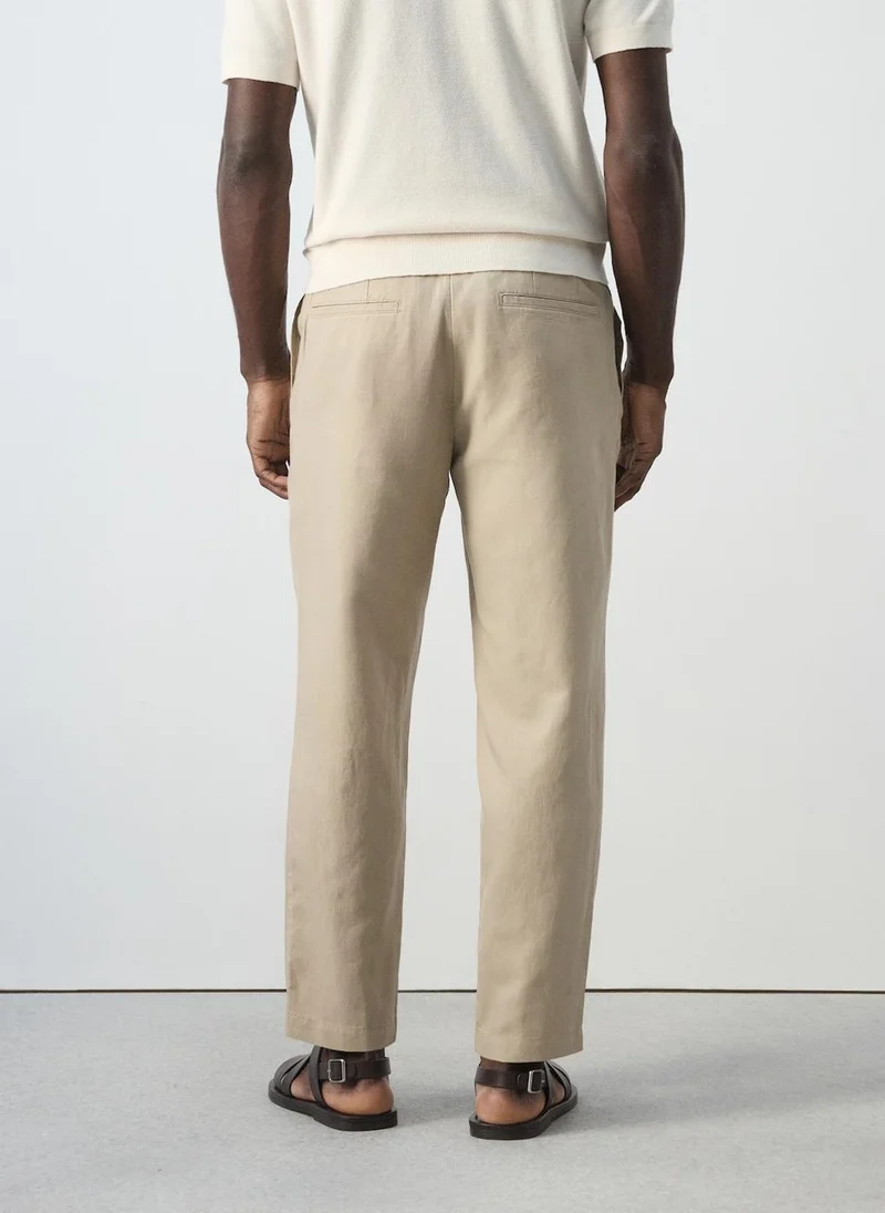 مانجو مان Slim Fit Cropped Linen-Cotton Trousers