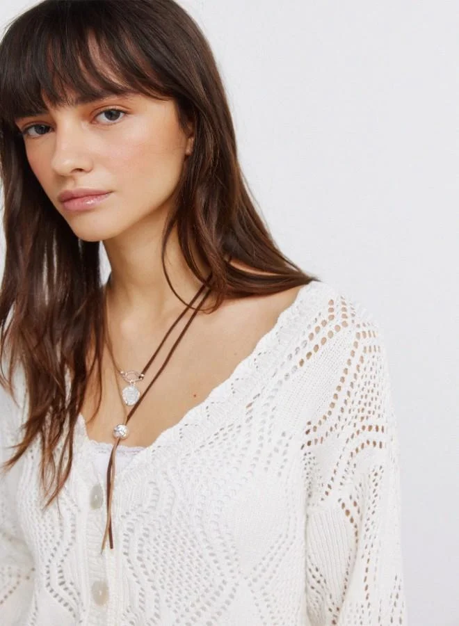 Springfield  White pointelle knit V-neck volume long sleeve openwork ribbed front button cardigan for Women | Best Price UAE