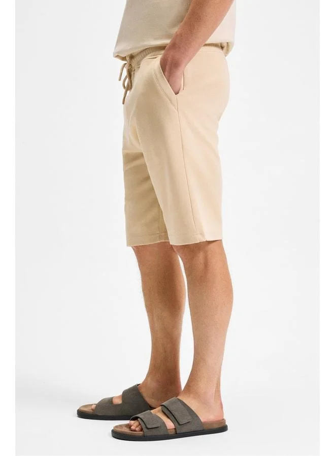 Grimelange CAMILO Men's Pocket Zip Elastic Waist Dark Beige Shorts & Bermuda.
