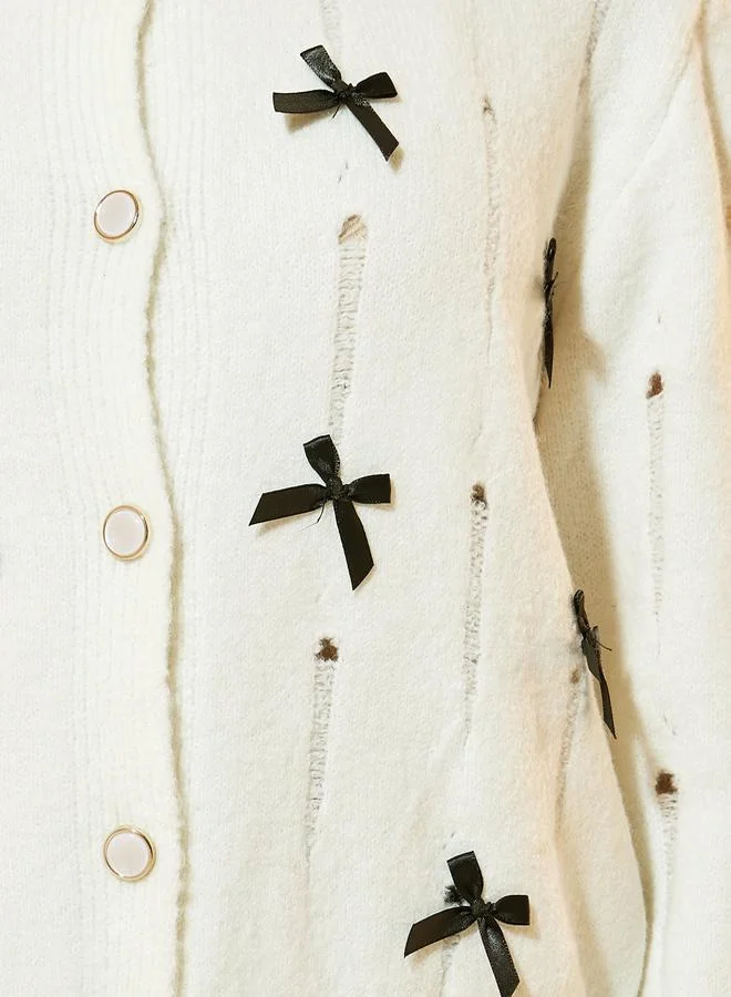 Take Two Solid Button Front Cardigan with Bow Details