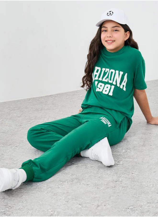 ستايلي Styli Girls Green Text Print Oversized T-Shirt and Joggers Set