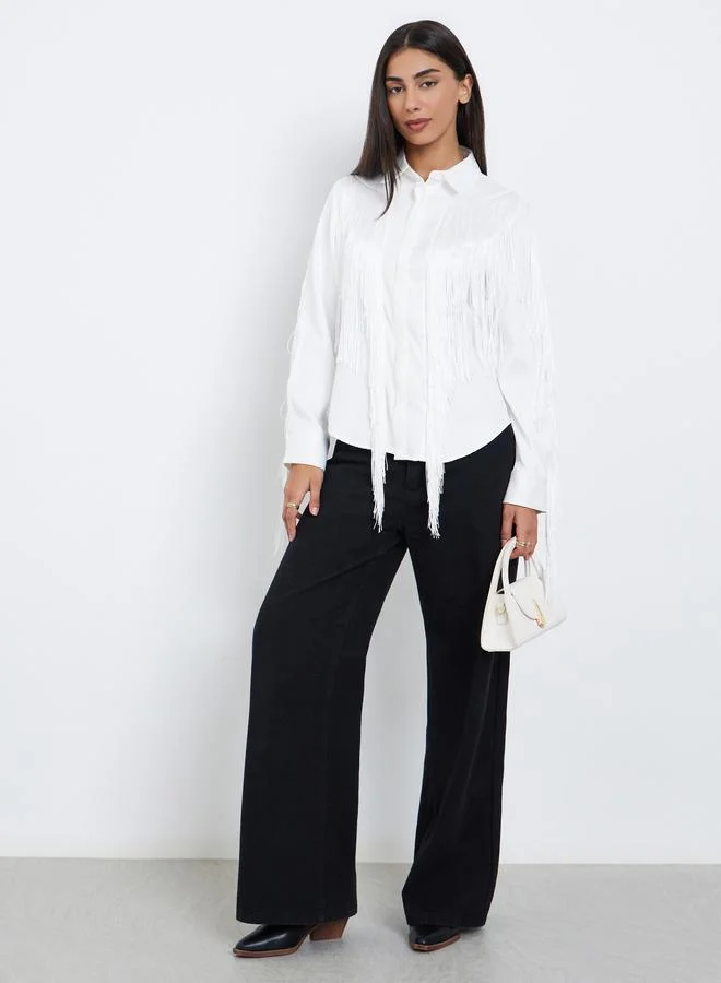 ستايلي بلوزة بشراشيب وشريط أزرار مخفي