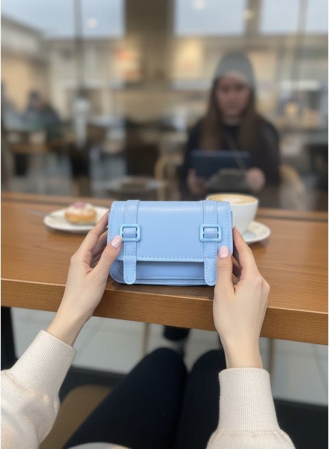 A stylish small shoulder bag featuring front buckle