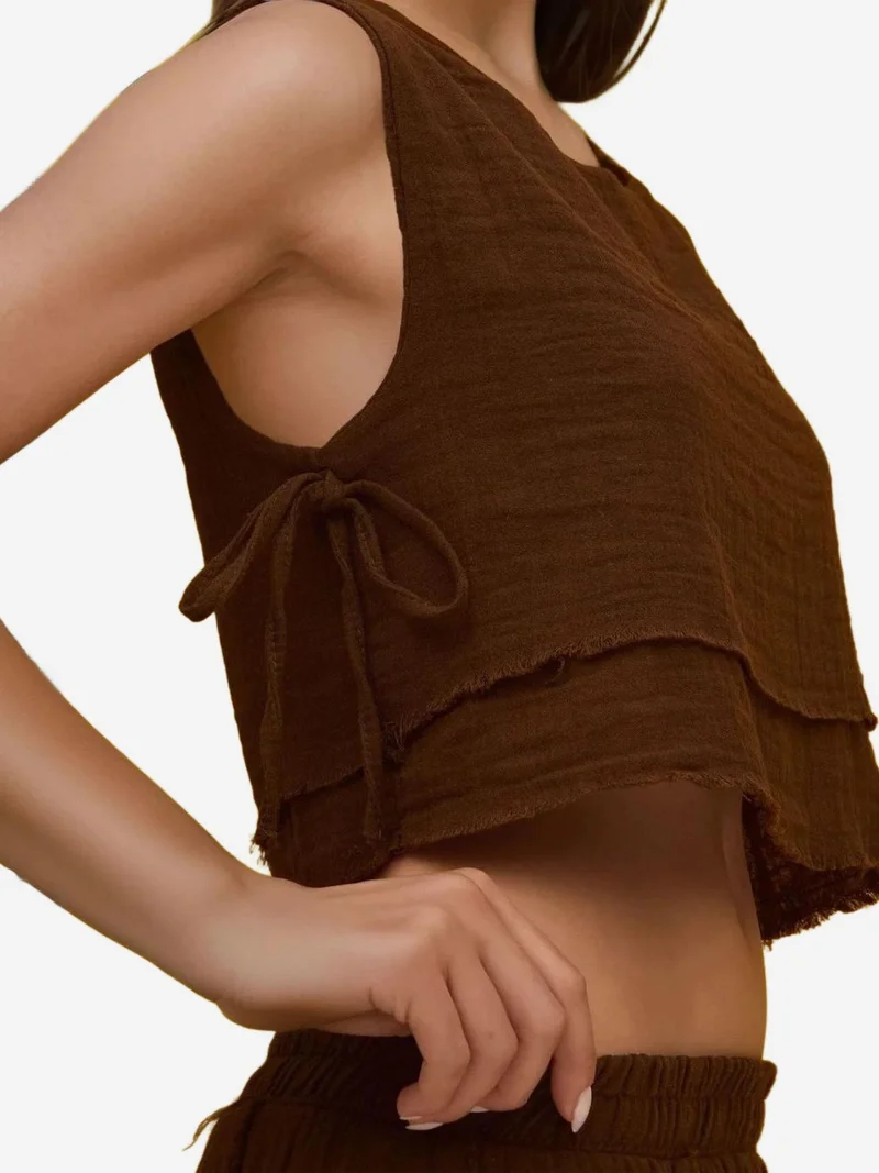 زوبعة طقم بلوزة وتنورة بخصر مطاطي وتفاصيل ربطة جانبية من الموسلين