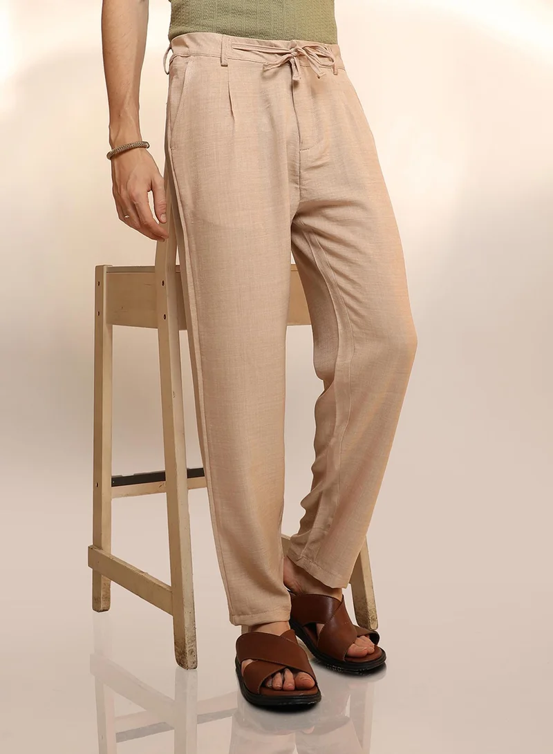 Campus Sutra Men's Saltbox Beige Solid Pleated Trousers