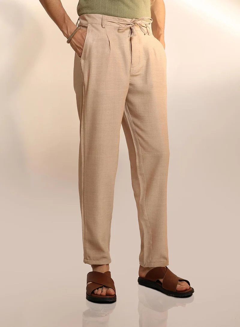 Campus Sutra Men's Saltbox Beige Solid Pleated Trousers