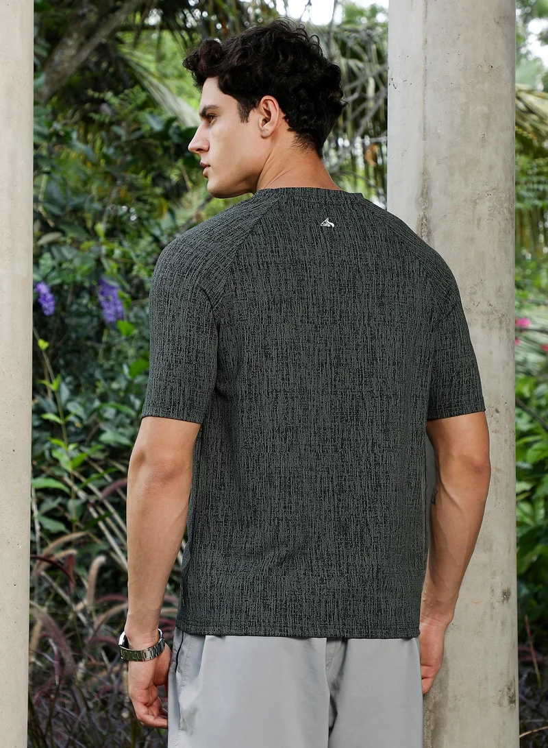 Campus Sutra  Men's Emerald Green & Midnight Black Contrast-Heathered Knitted T-Shirt for Men | Best Price UAE