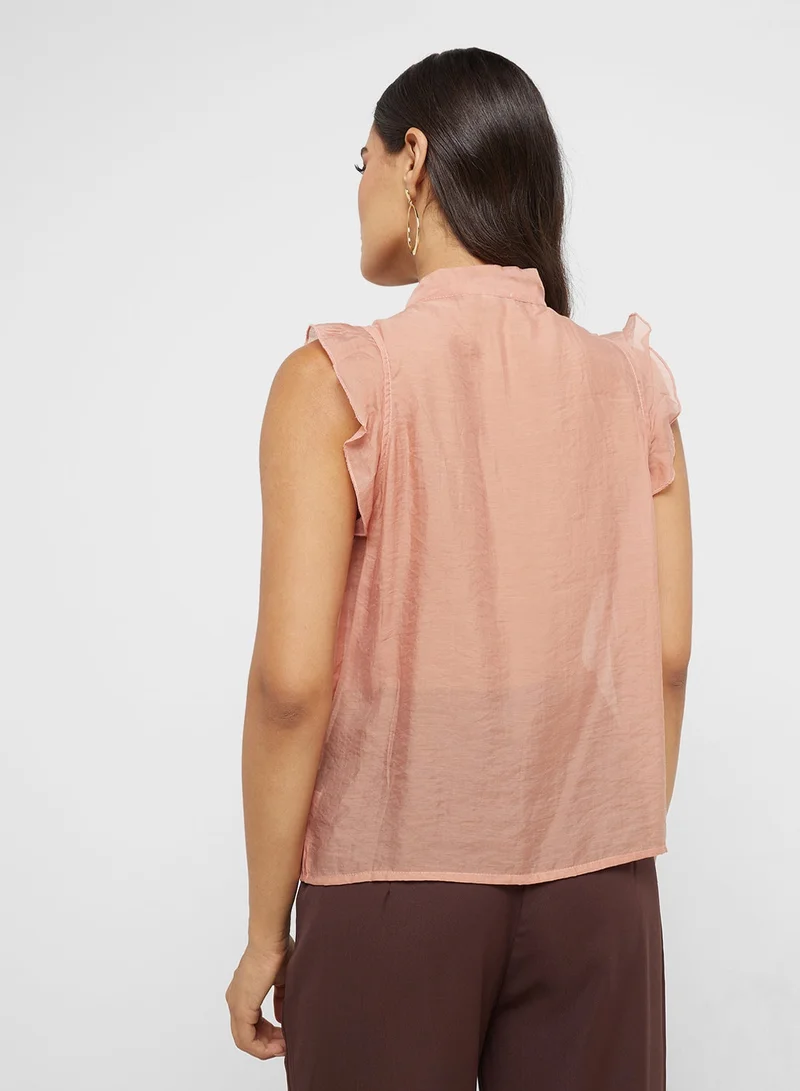 ايلا بلوزة بدون أكمام بكشكشة