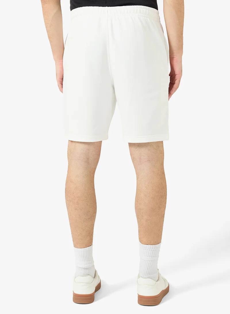 LACOSTE  Regular Fit Embossed Unbrushed Fleece Shorts for Men | Best Price UAE