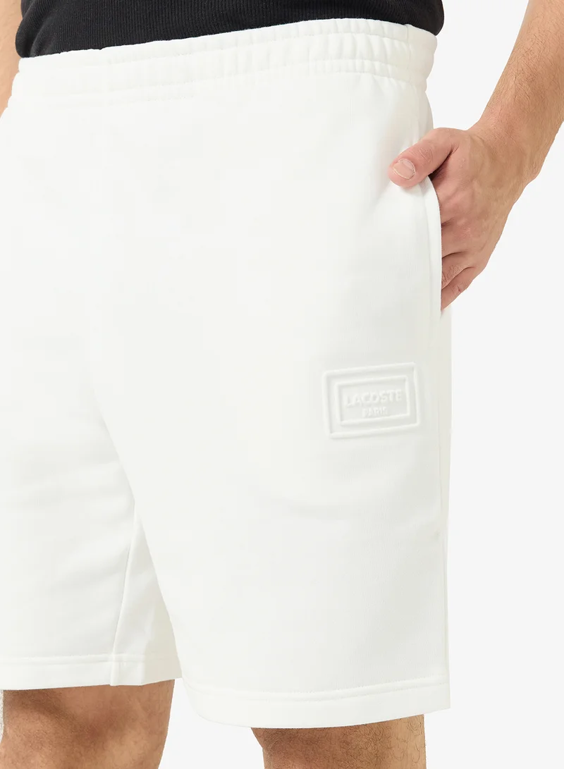 LACOSTE  Regular Fit Embossed Unbrushed Fleece Shorts for Men | Best Price UAE