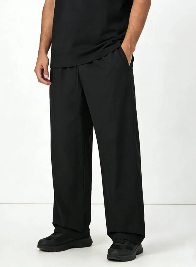 تايك تو Men Black Solid Relaxed Fit Trousers