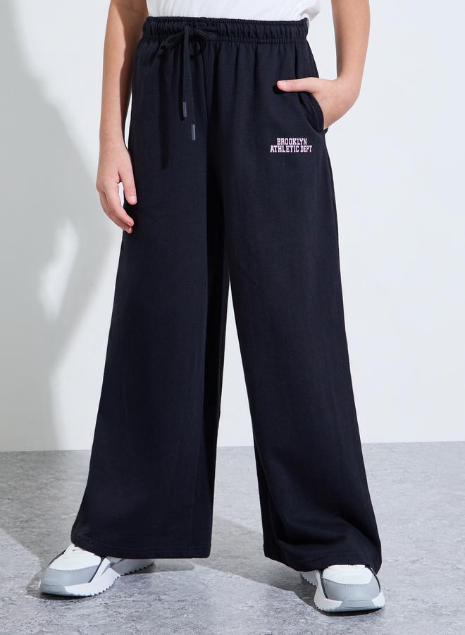 Styli Teen Girls Black Slogan Print Wide Leg Pants - Image 1